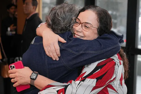 Women embracing